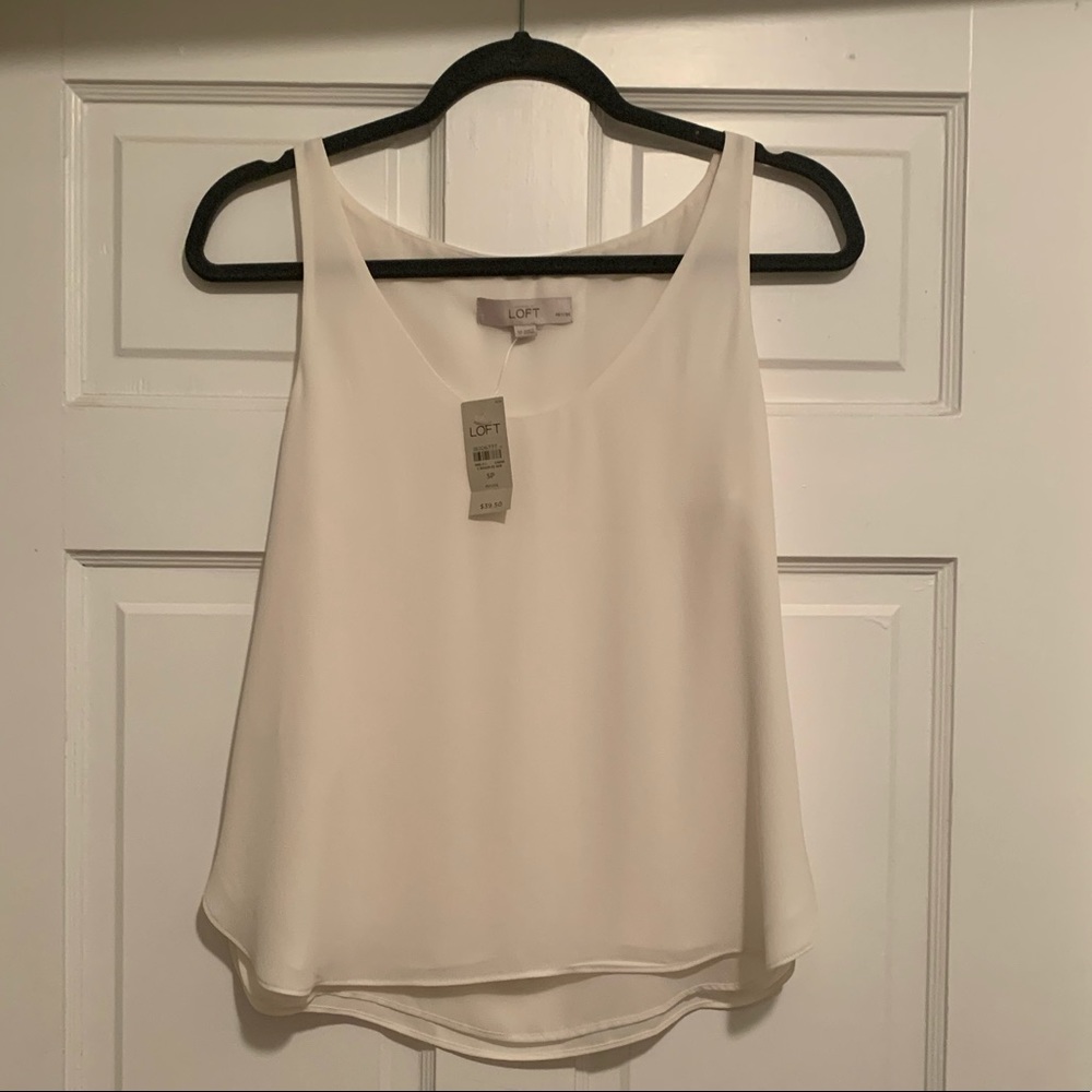 Cream colored Loft blouse. Size small petite. Never worn. Great condition.